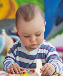 Child playing a board game